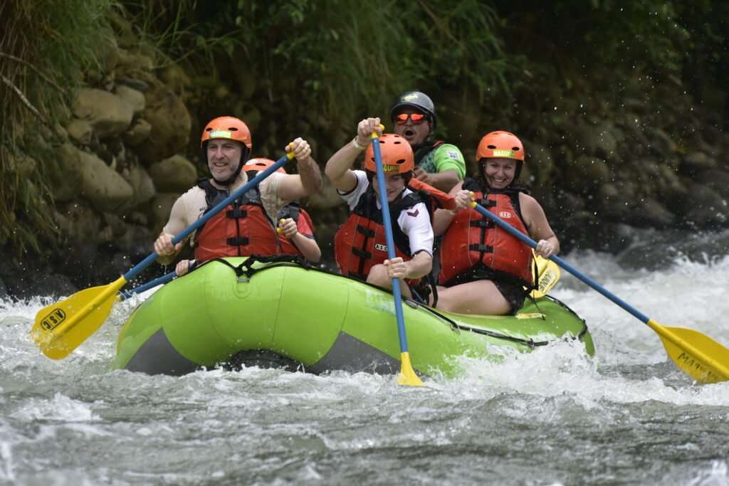Tour guide leading rafting trip in Arenal River Costa Rica Easter vacation
